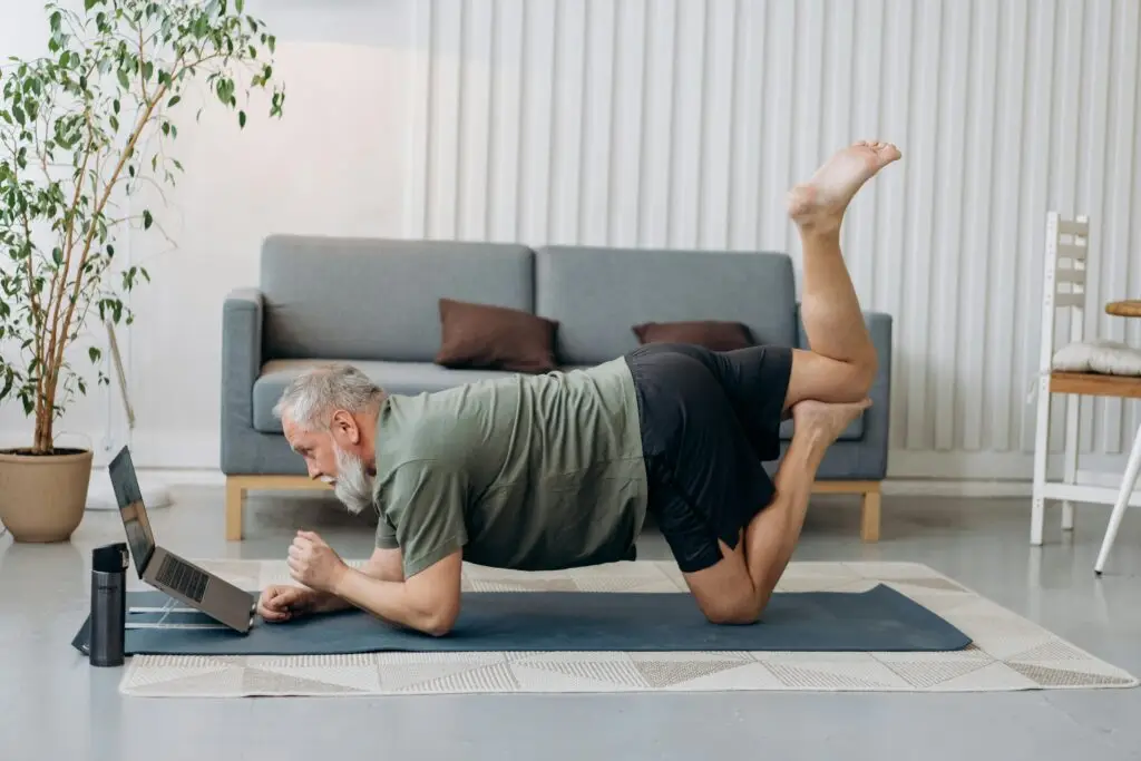 Man practicing yoga for holistic wellness and oral health